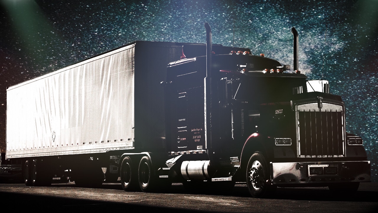 A semi-trailer truck against a starry sky